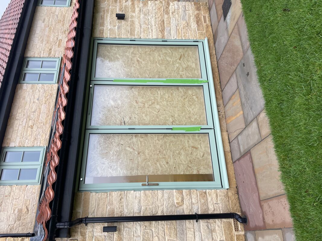 New bifold doors exterior during fitting